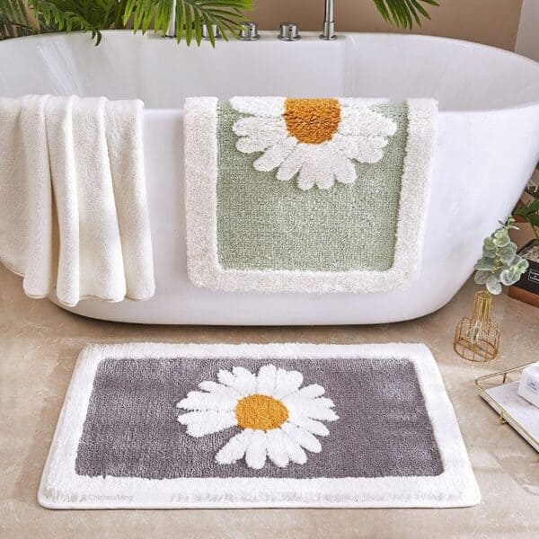 Bloemen badmat met margrietmotief voor badkamerdecoratie.