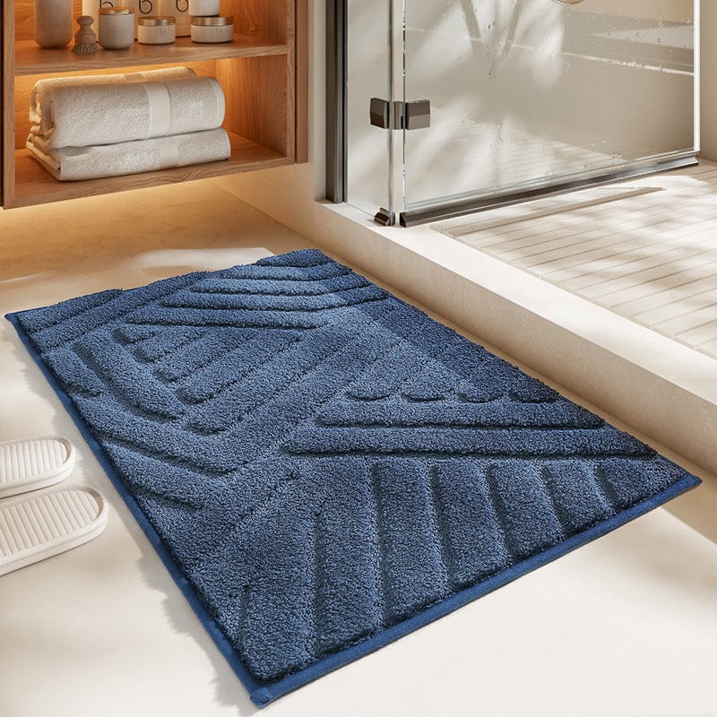 Grote blauwe badmat met geometrisch patroon voor badkamer.
