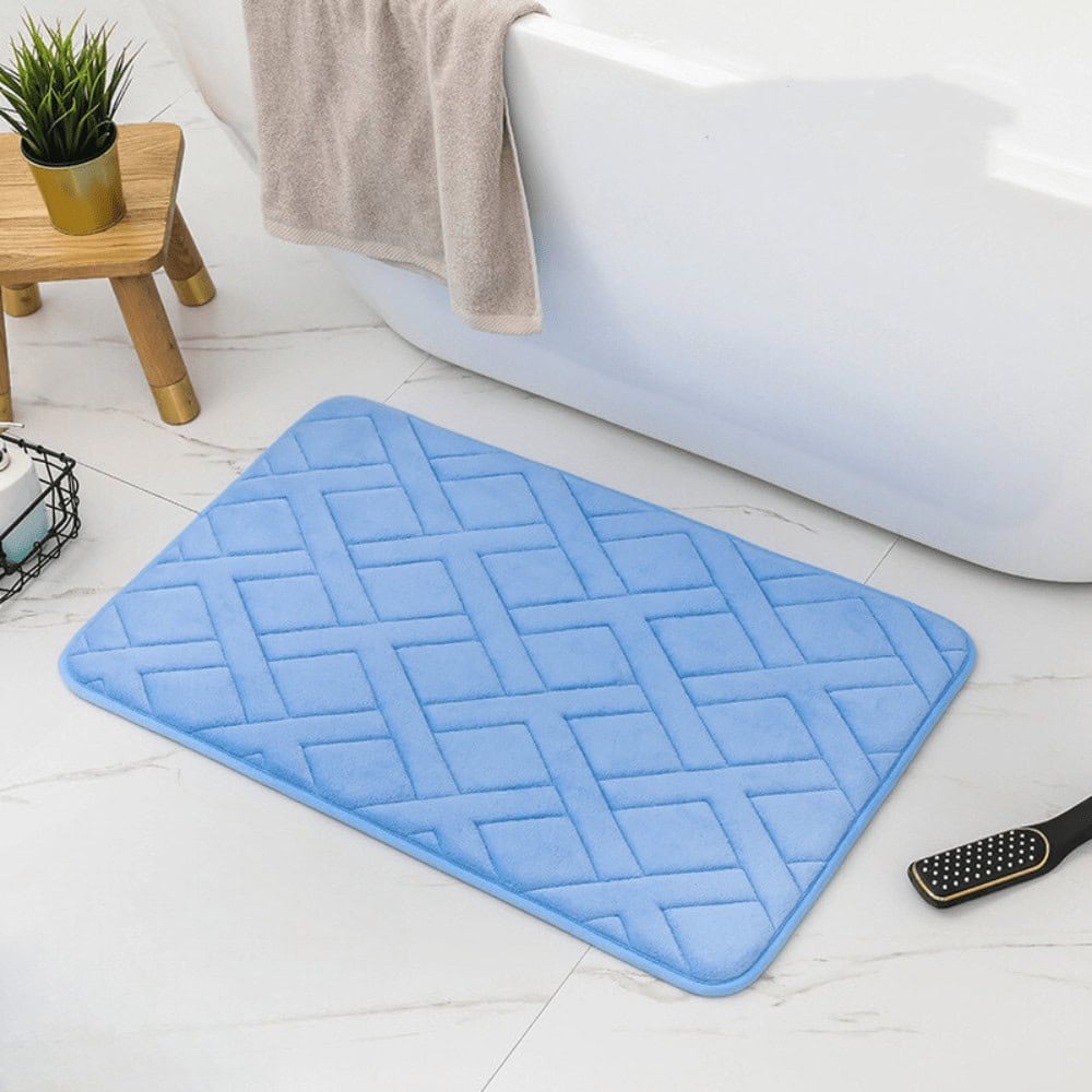 Luxe blauwe dikke badmat met quiltingpatroon voor badkamer.