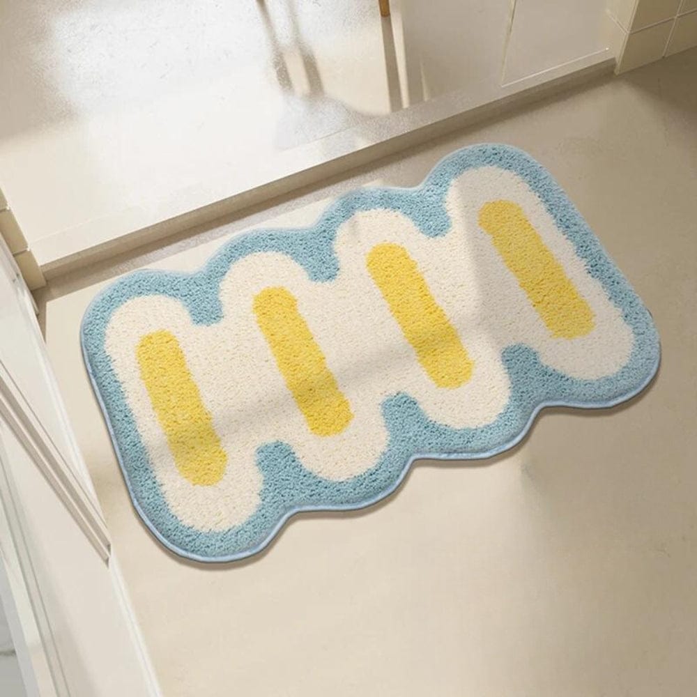 Origineel vormgegeven badkamerkleed met blauw en geel design.