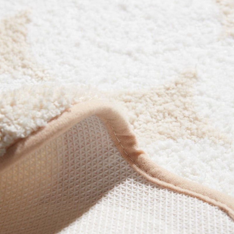 Zwart-wit badkamermat met zachte textuur en anti-slip onderkant.