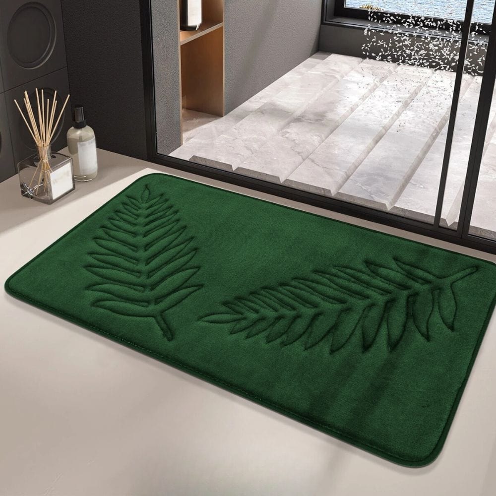 Groene badmat met bladmotief voor badkamer.