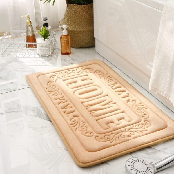 Rechthoekige badmat met antislip textuur en 'HOME' lettering.