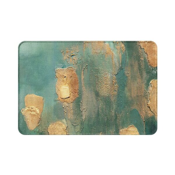 Watergroene badmat met abstracte textuur en goudkleurige accenten.