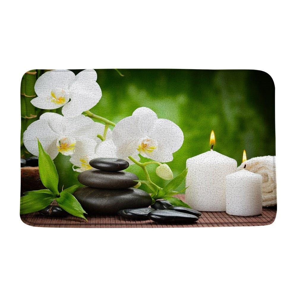 Zen badkamer tapijt met orchideeën, stenen en kaarsen voor ontspanning.