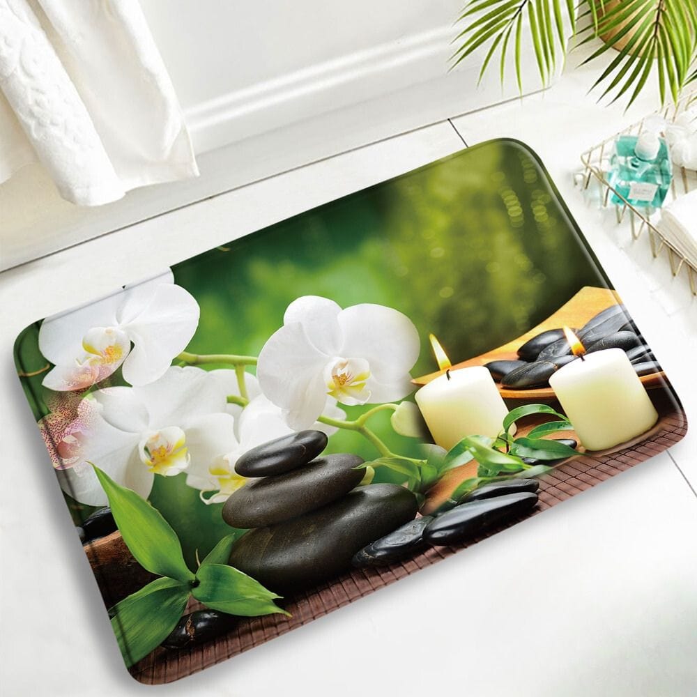 Zen badmat met antislip oppervlak, orchideeën en stenen voor rust in badkamer.