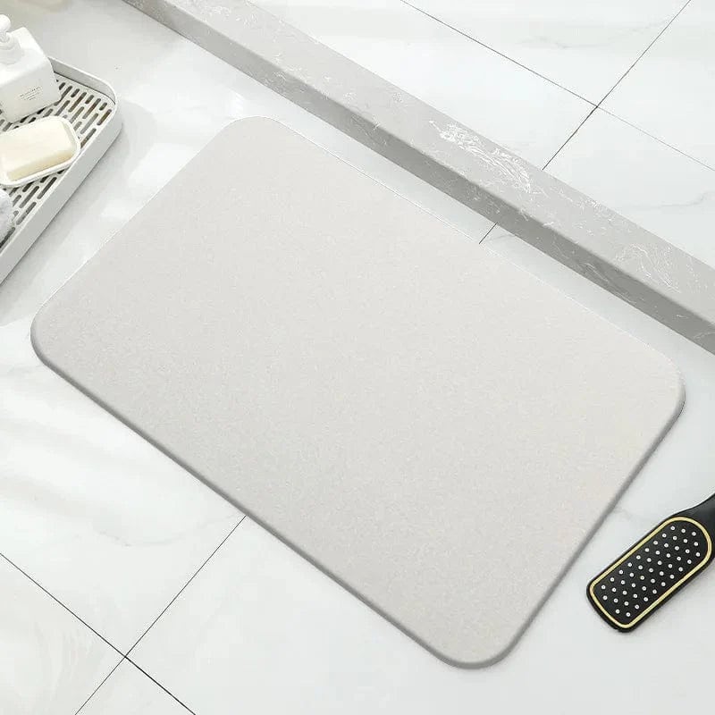 Grijze badkamerstenenmat voor voetbedekking, waterbestendig en comfortabel.