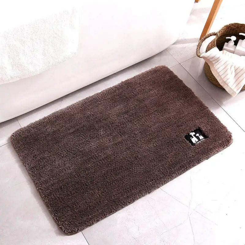Bruine badmat voor badkamer met comfortabele textuur en stijlvolle look.