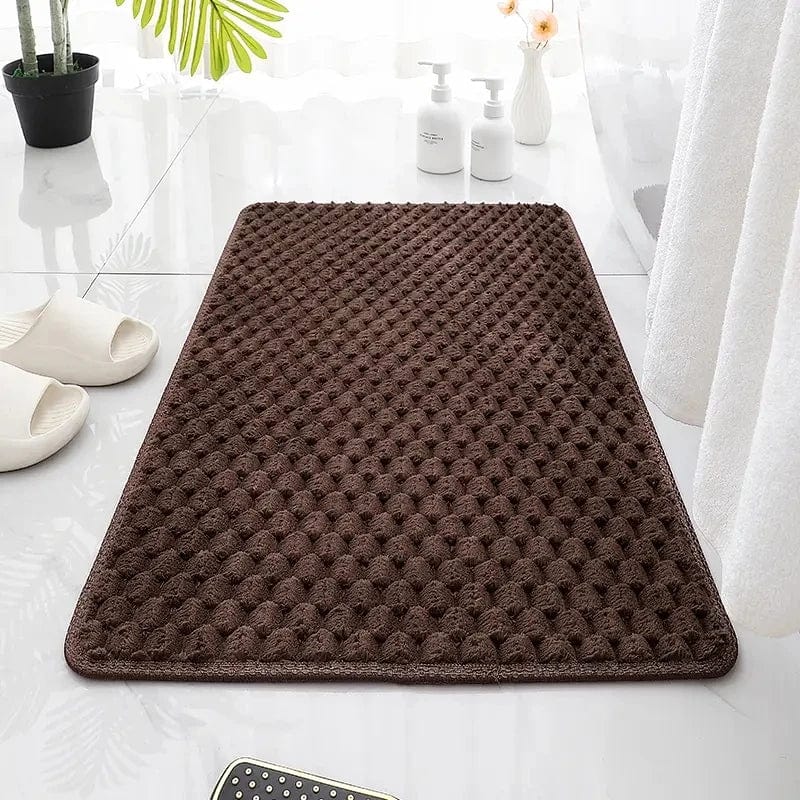 Bruine chocolade badmat met textuur, perfect voor badkamer.
