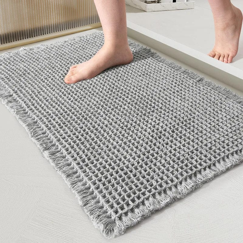 Geweven badkamertapijt met franje, grijze kleur, comfortabel voor voeten.