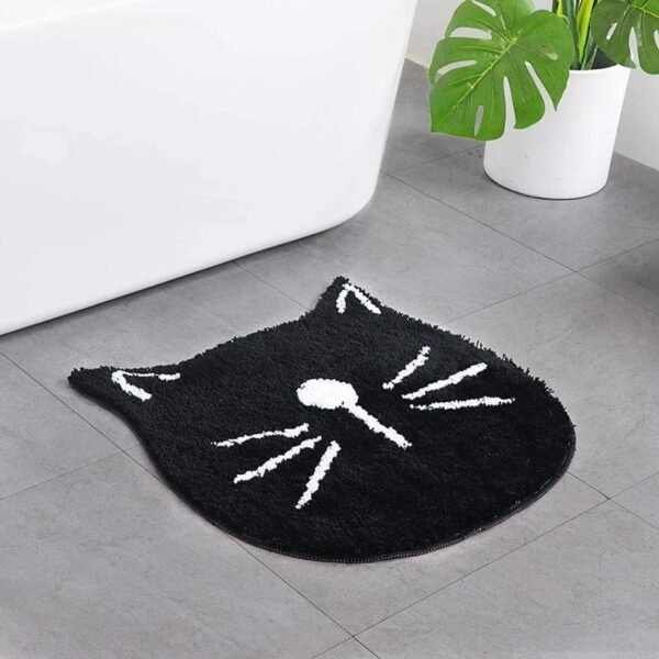 Kattenbadmat anti-slip zwart met witte vacht en ogen.