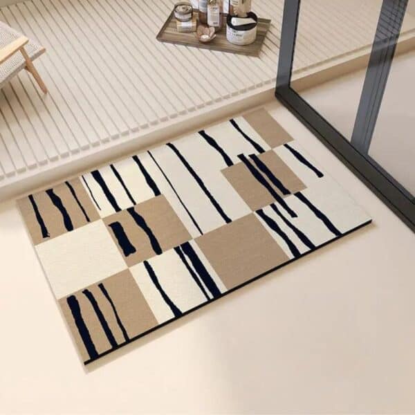 Moderne diatomee badmat met geometrisch patroon in beige en zwart.
