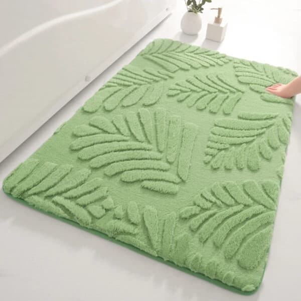 Groene badmat met bladmotief voor badkamer.