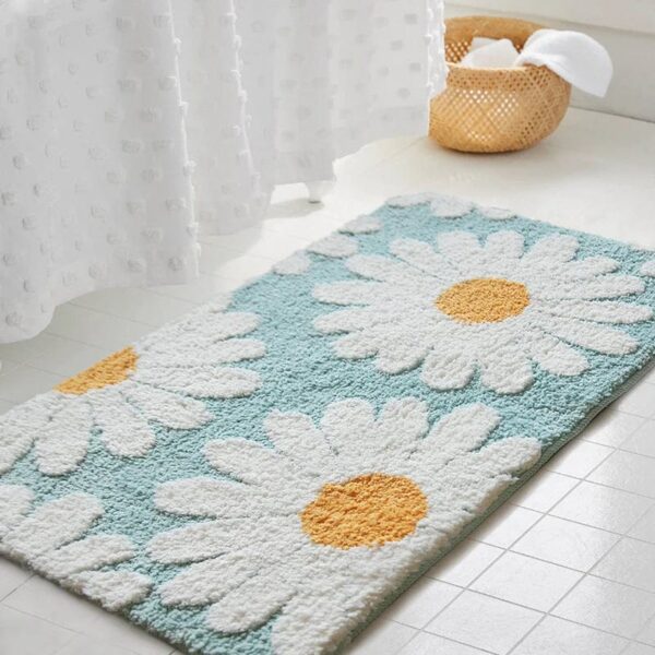 Scandinavische badmat met daisymotief in blauw en geel.