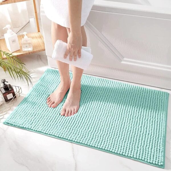 Turquoise badmat voor badkamer, stijlvol tapijt met textuur.