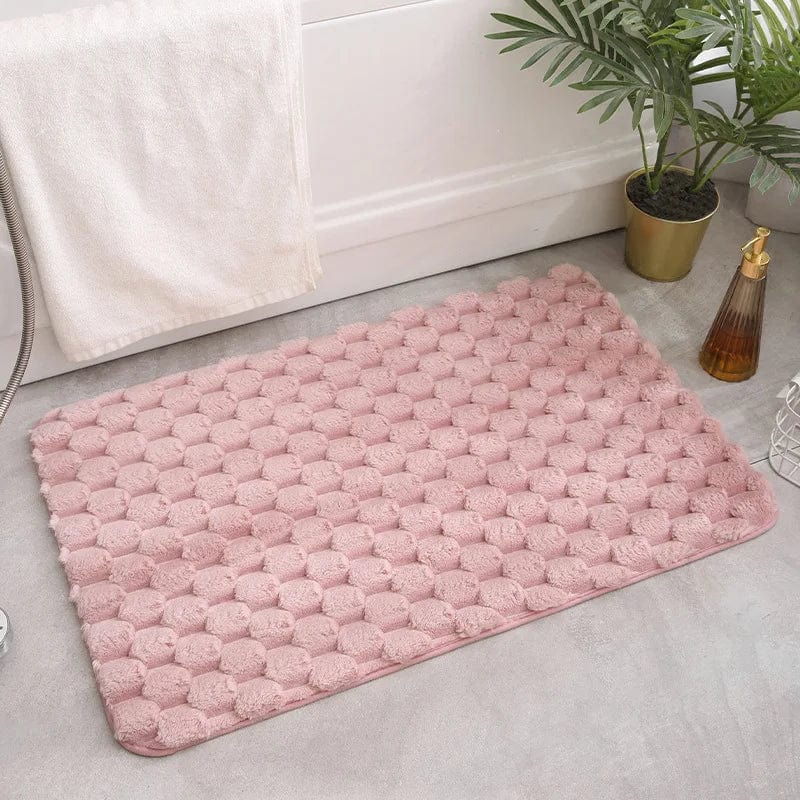 Ultrazachte badmat met antislip structuur in roze.