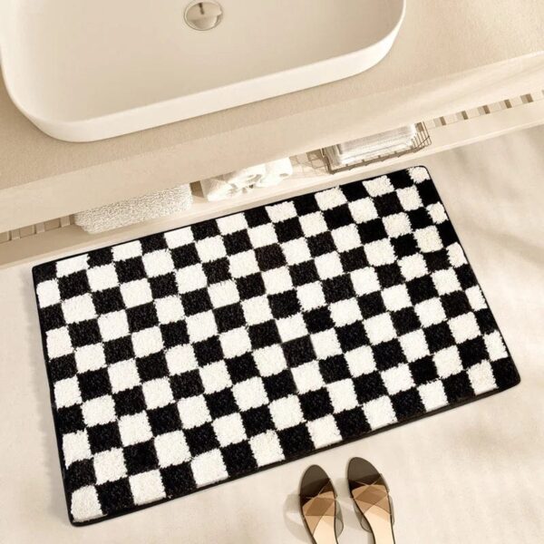 Zwart-wit geometrisch badmat voor badkamer, stijlvol en modern design.