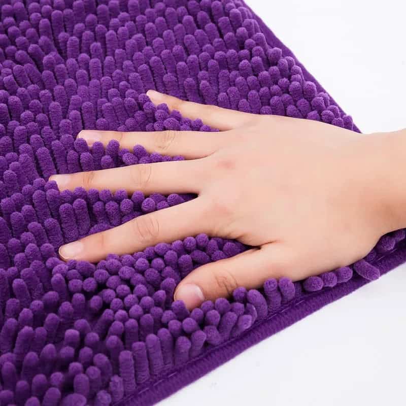 Purple 60x90 Bath Mat with Hand Touching Textured Surface.