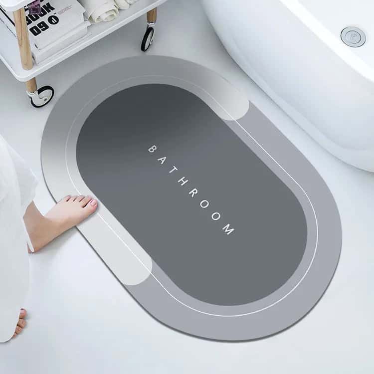 Anti-slip bathroom mat with 'BATHROOM' text, modern grey design.