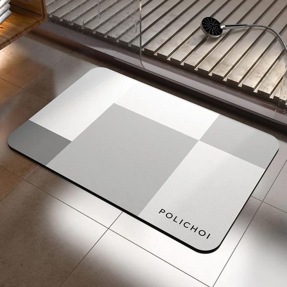 Anti-slip bath mat with geometric grey pattern for bathroom safety.