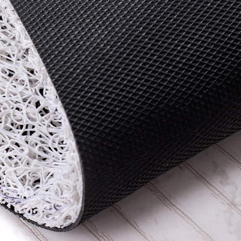 Art Deco Bath Mat Close-Up: Black Mesh Top with White Textured Back.