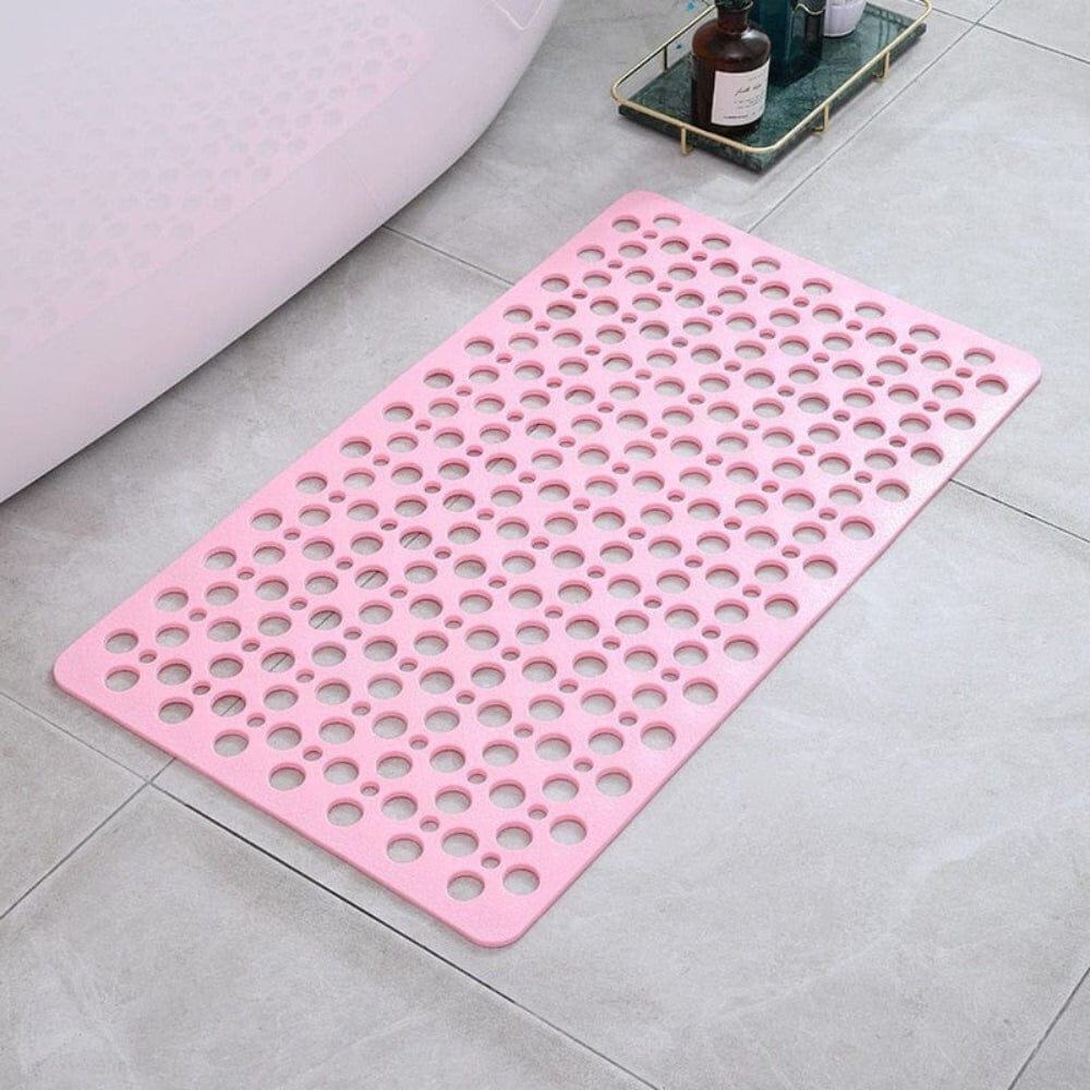 Pink bath massage mat with drainage holes for comfort and safety.