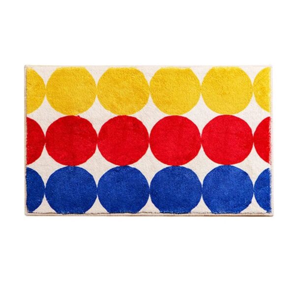 Colorful circle bath mat with yellow red blue dots.