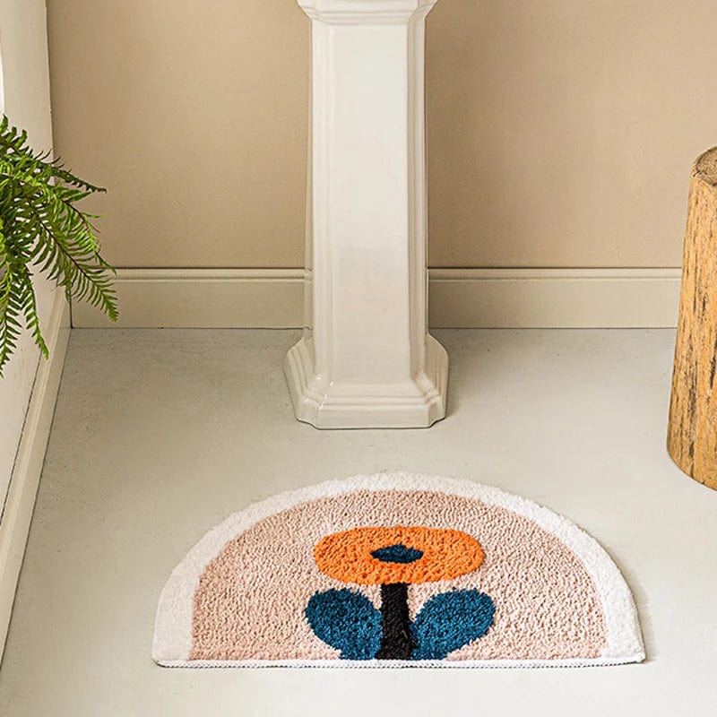 Floral Bath Mat with Orange and Blue Flower Design.