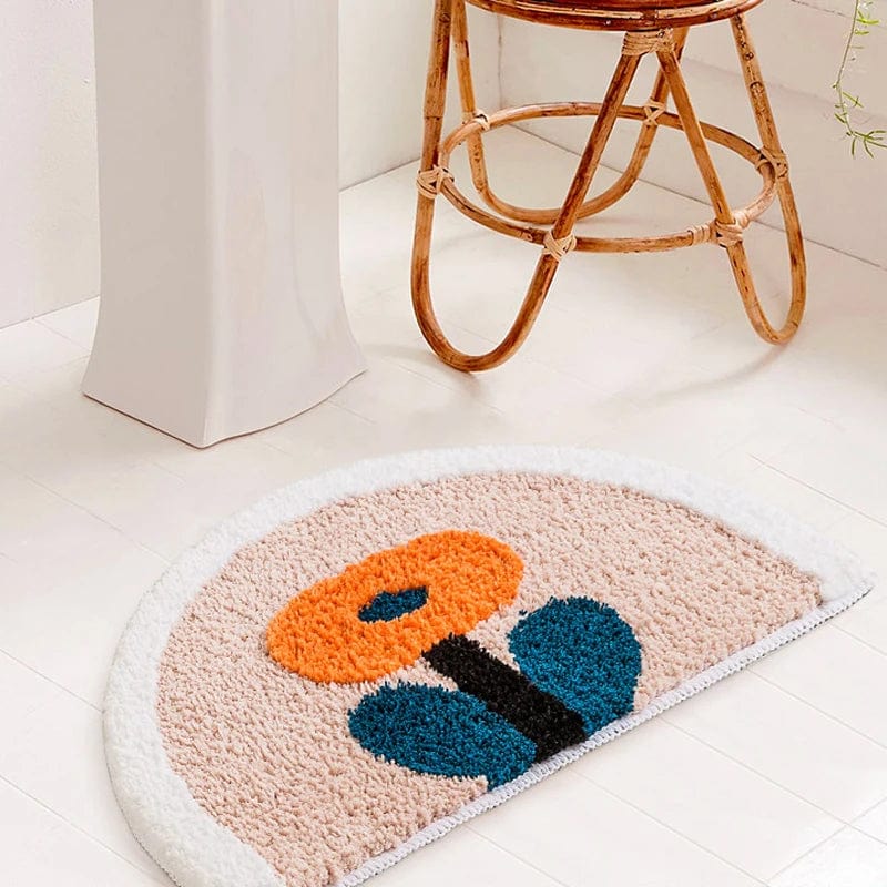 Floral Bath Mat with Orange and Blue Design.