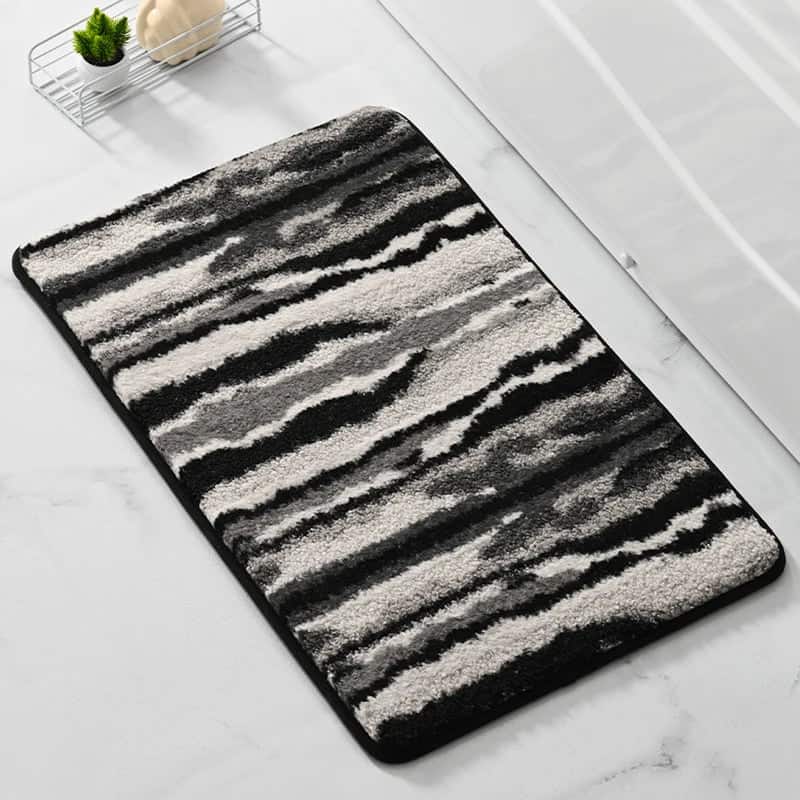 Zebra print bath mat for bathroom floor, non-slip, plush, modern design.