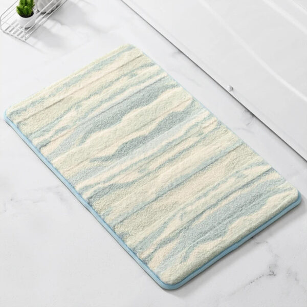 Soft blue and cream striped bath mat for bathroom floor.