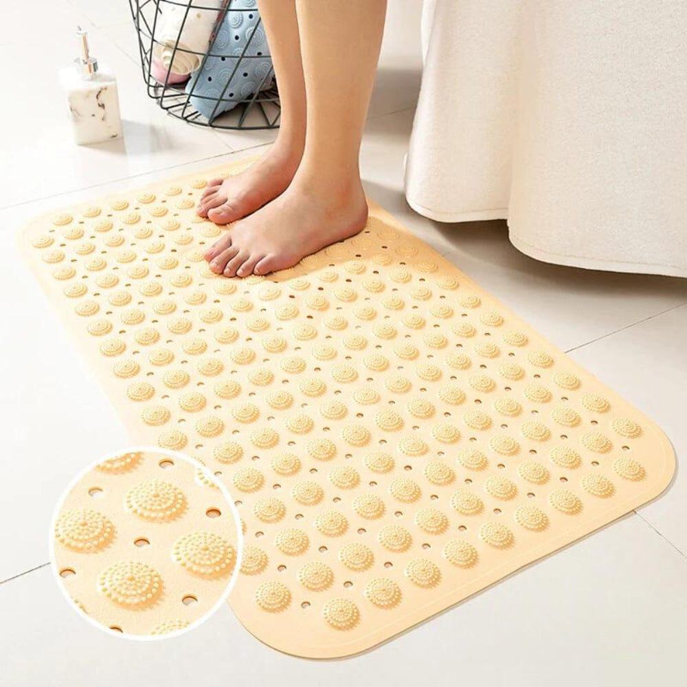 Non-slip bath mat with textured grip for bathroom safety.