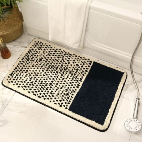 Modern leopard print bath mat with navy blue panel for stylish bathroom decor.