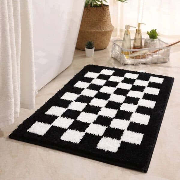 Black and white checkered bath mat for modern bathroom decor.