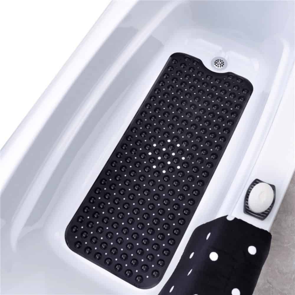 Black non-slip bath mat with raised dots for safety in bathtub.