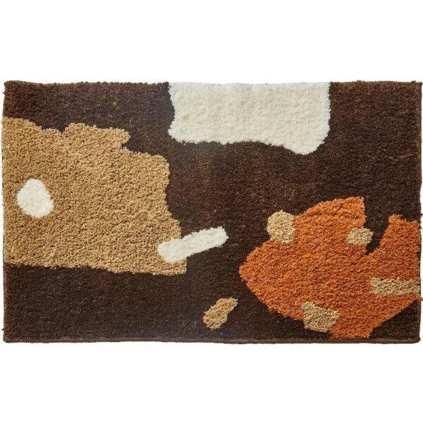 Brown and cream cow print bath mat with fluffy texture.