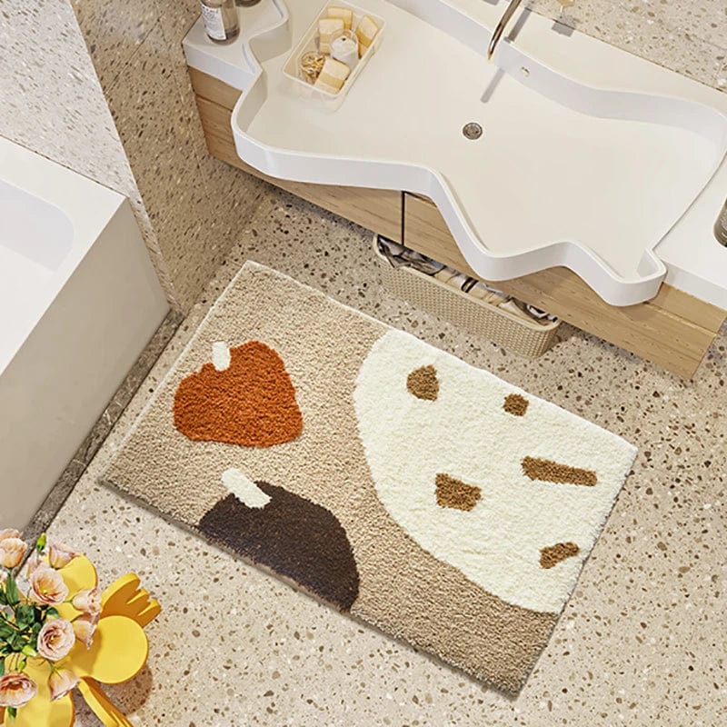 Brown and cream abstract bath mat in modern bathroom.