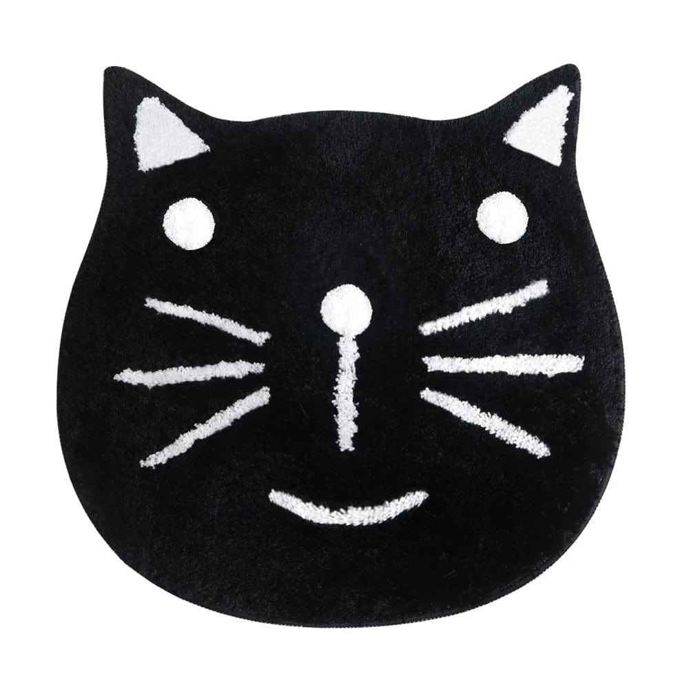 Black cat face bath mat with white whiskers and eyes.