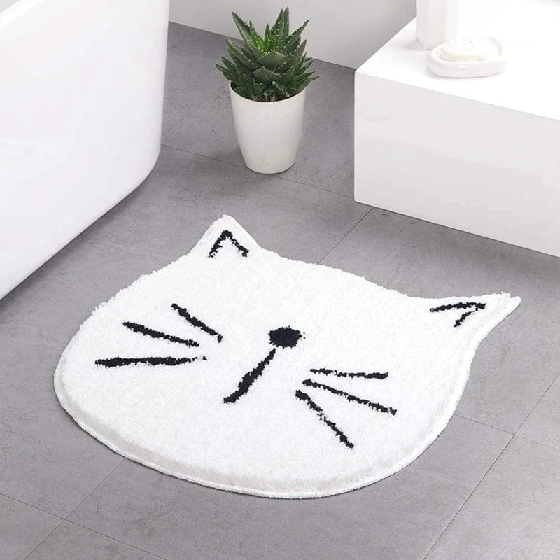 White cat face bath mat for bathroom with cute whiskers and nose.