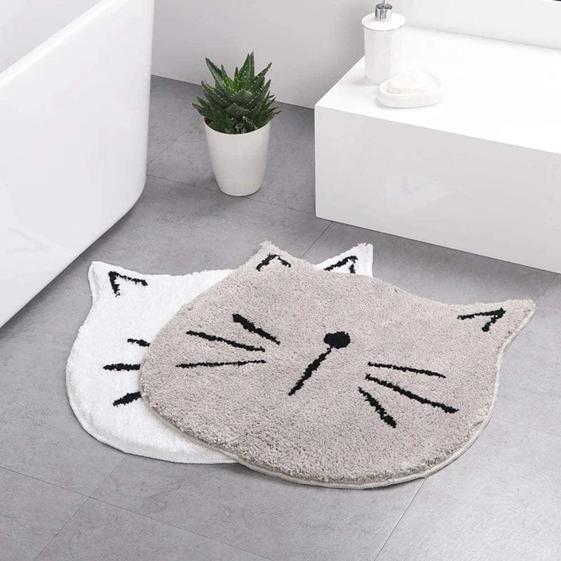 Cute cat-shaped bath mat for bathroom, fluffy grey and white designs.