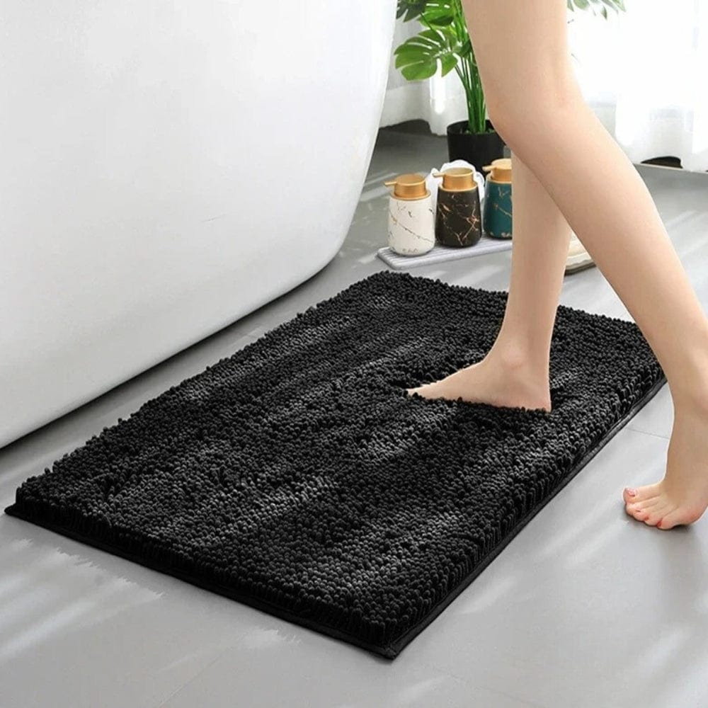 Black Chenille Bath Mat for Comfortable Footsteps.