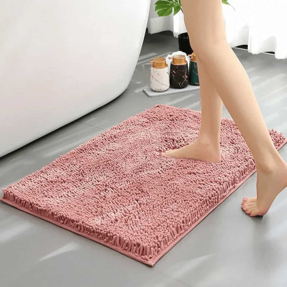 Pink Chenille Bath Mat for Soft Comfort.