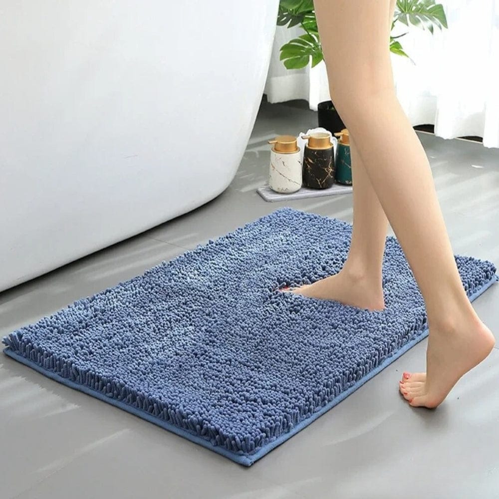 Blue Chenille Bath Mat for Slip-Resistant Bathroom Comfort.