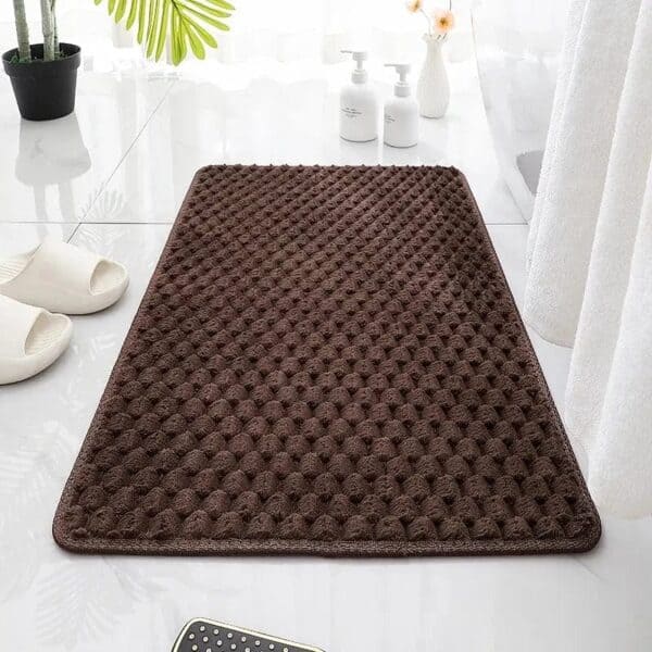 Chocolate brown textured bath mat for bathroom comfort and style.
