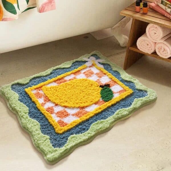 Citrus-themed bath mat with lemon design for bathroom.