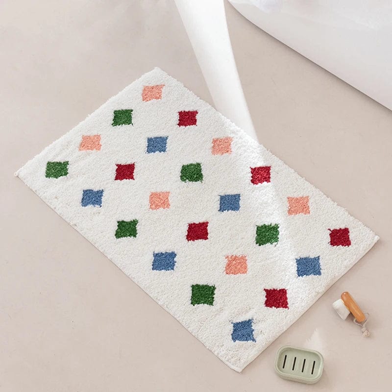 Colourful bath mat with geometric pattern for bathroom.