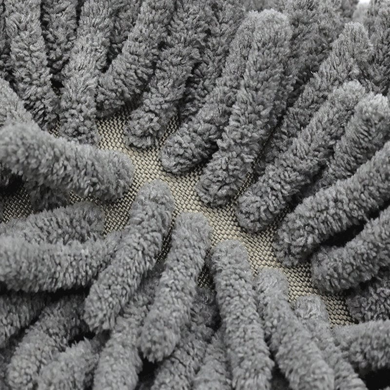 Dark green plush bath mat with textured loops for comfort and grip.