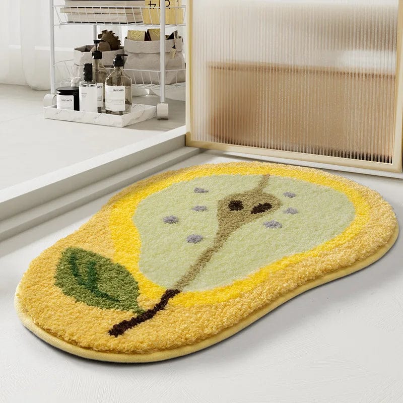 Yellow pear-shaped designer bath mat with fluffy texture.