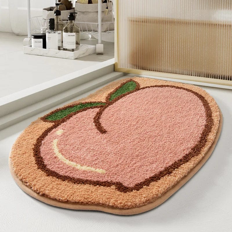 Cute peach-shaped designer bath mat for bathroom decor.