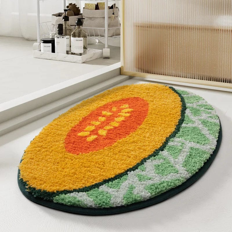 Designer papaya-themed bath mat with plush texture for modern bathroom decor.
